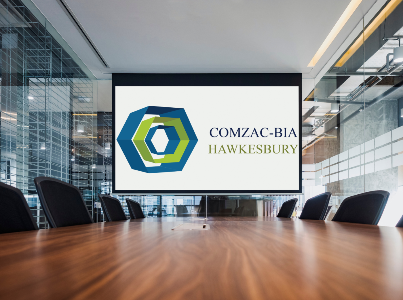 Generic image of a conference room with the Town of Hawkesbury's COMZAC-BIA logo on the projection screen.