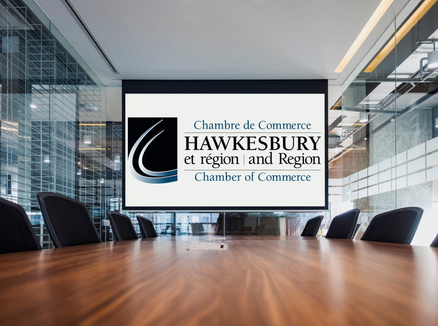 Generic image of a conference room with the Town of Hawkesbury and Region Chamber of Commerce logo on the projection screen.