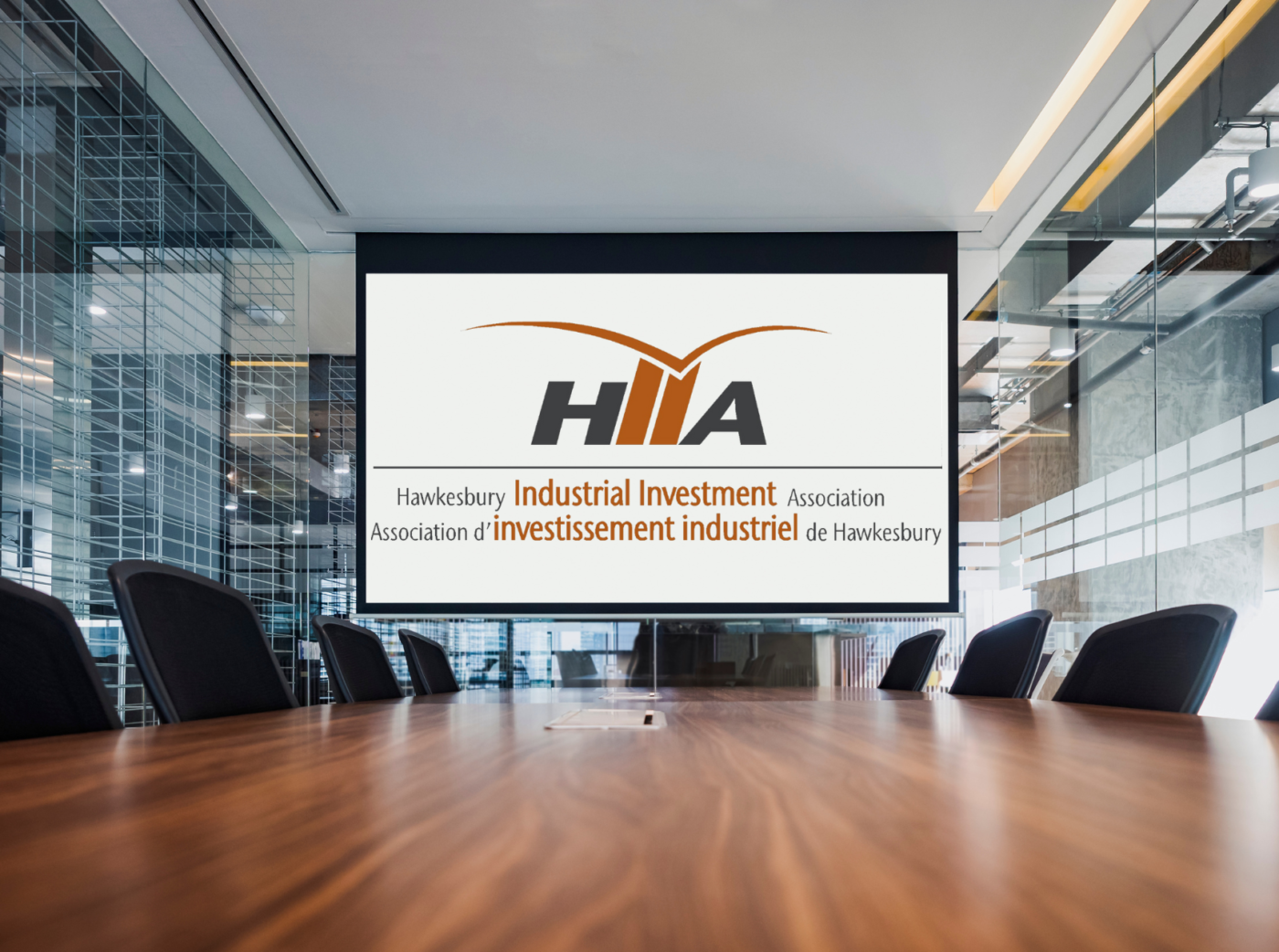 Generic image of a conference room with the Hawkesbury Industrial Investment Association logo on the projection screen.