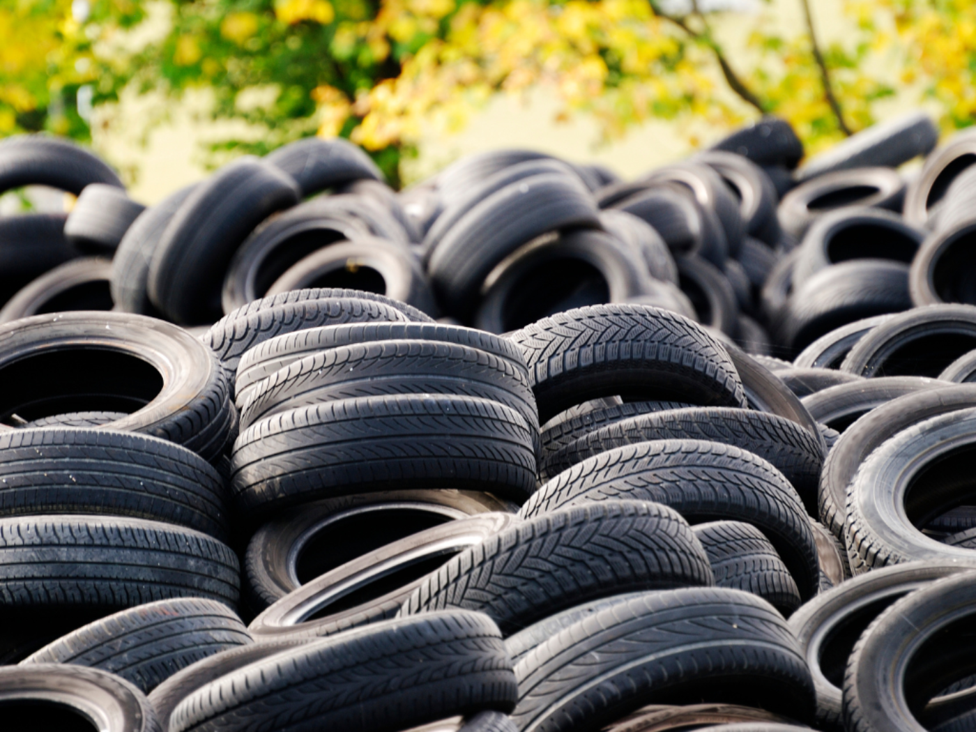 Picture of a pile of car tires.
