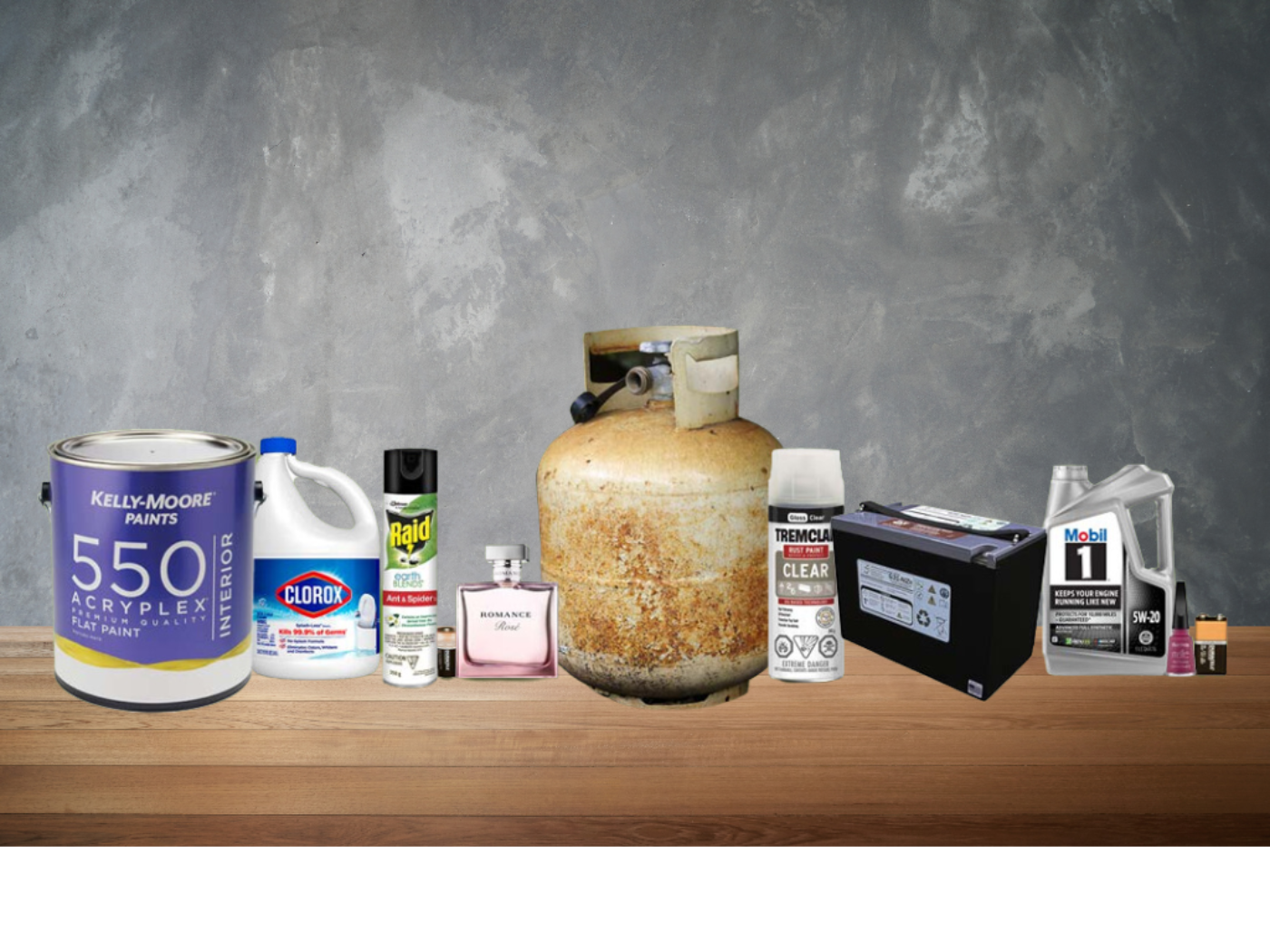 A collection of household items lined up including a propane bottle, paint can, bleach, insecticide, perfume bottle, motor oil bottle, car battery and lighter.
