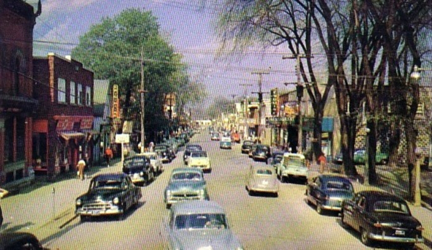 Photo of a car-filled Main Street.