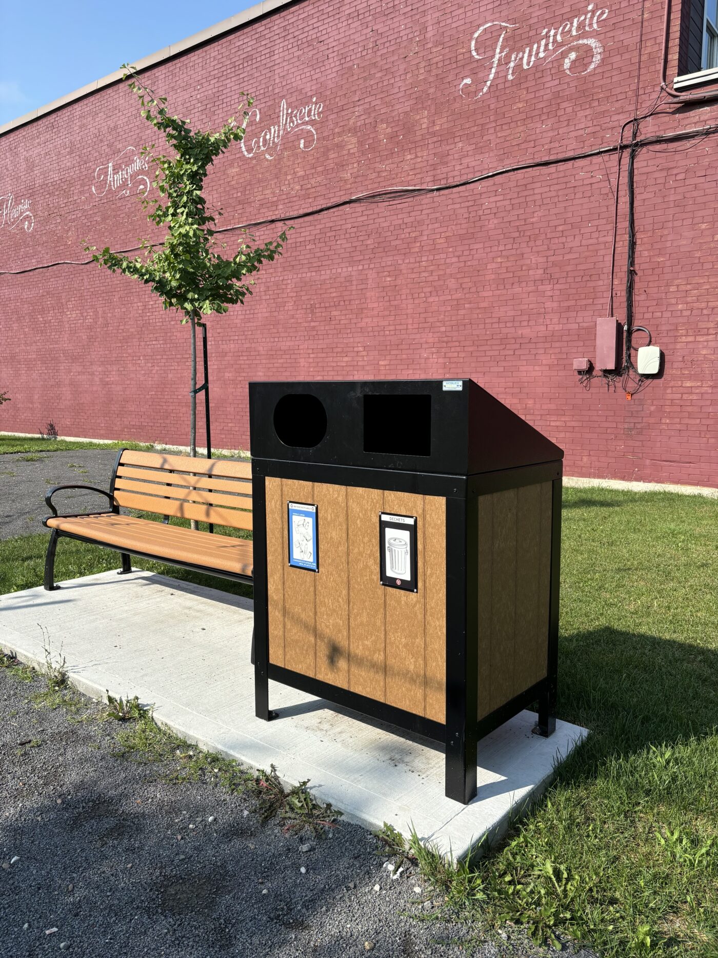Photo of a park bench and trash bin