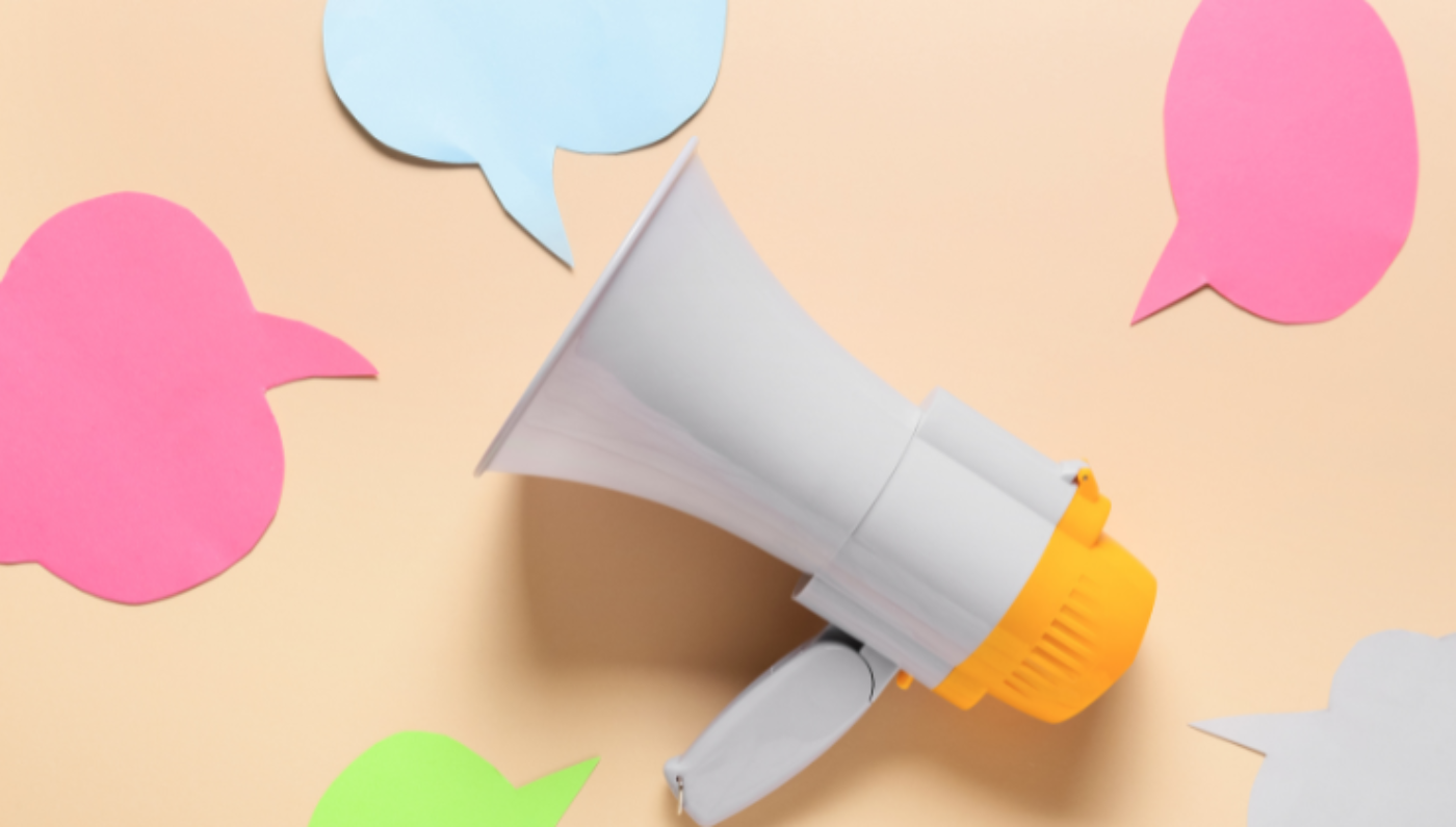 Generic image of a megaphone surrounded by paper dialogue bubbles