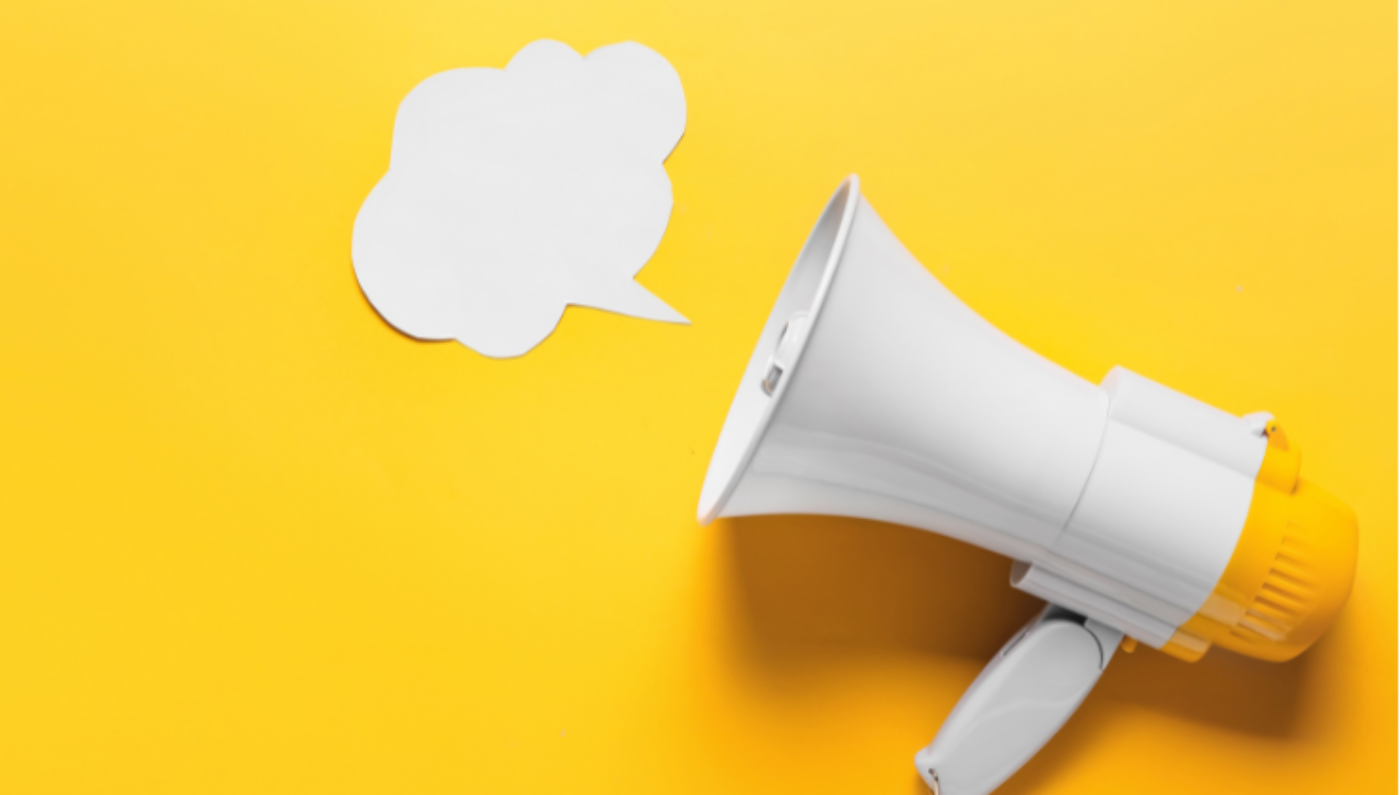 Generic image of megaphone with a white speech bubble cutout and yellow background