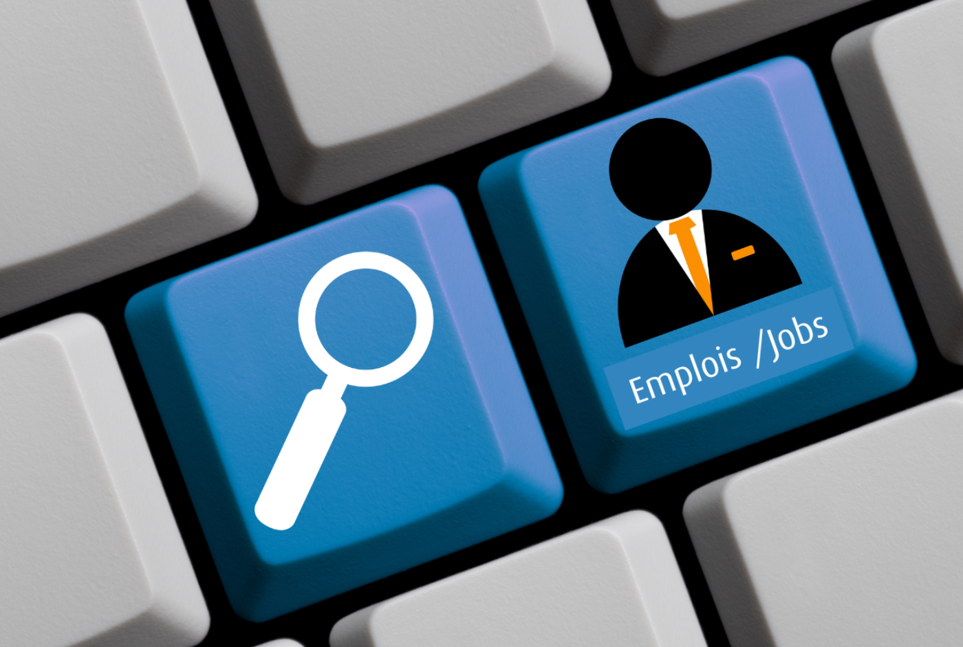 Image of two blue keys on a computer keyboard with either a magnifying glass icon or an icon of a man in a suit with the text ‘'Emplois/Jobs’'.