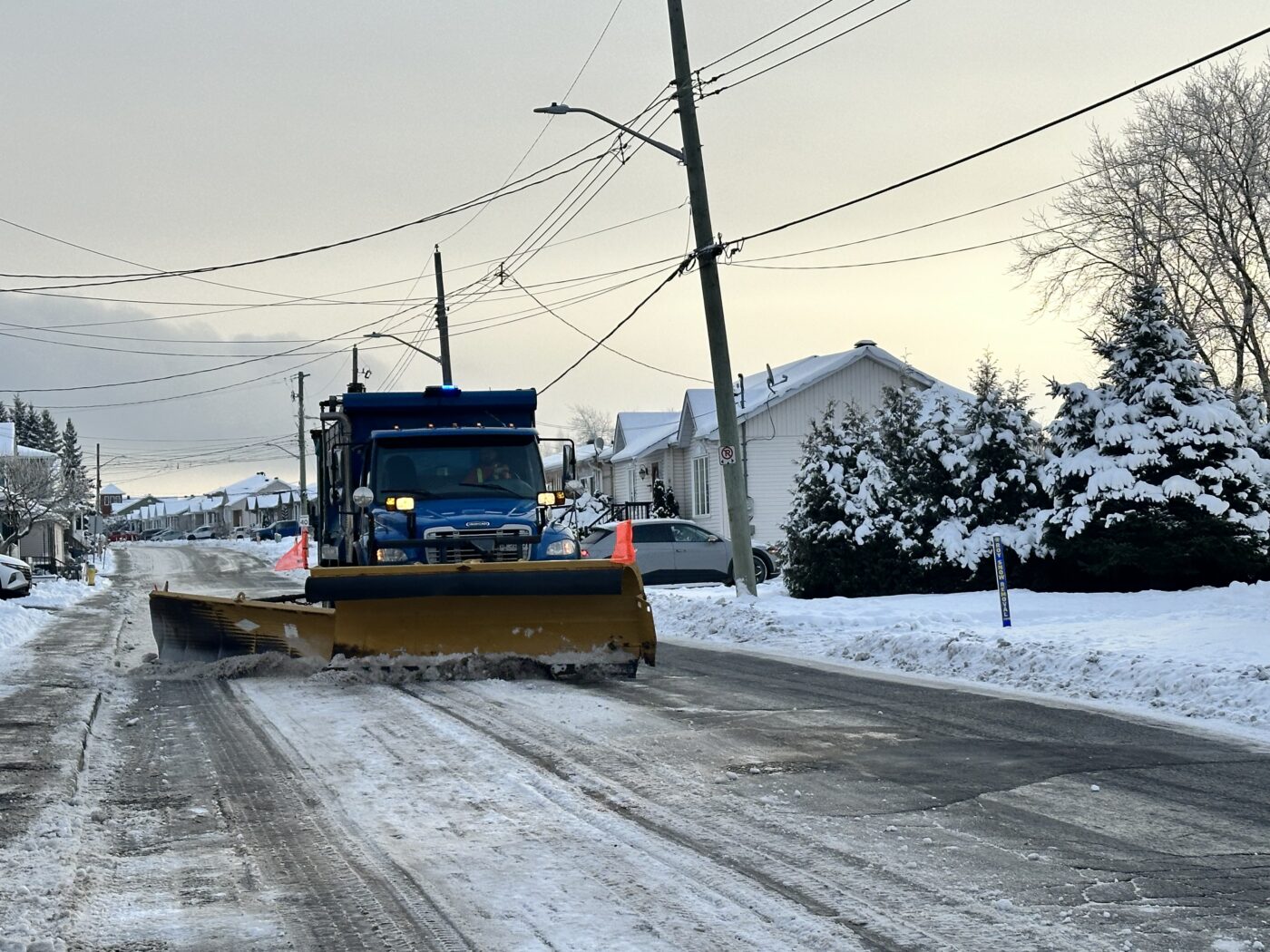 Photo of a snow removal truck passing on a street