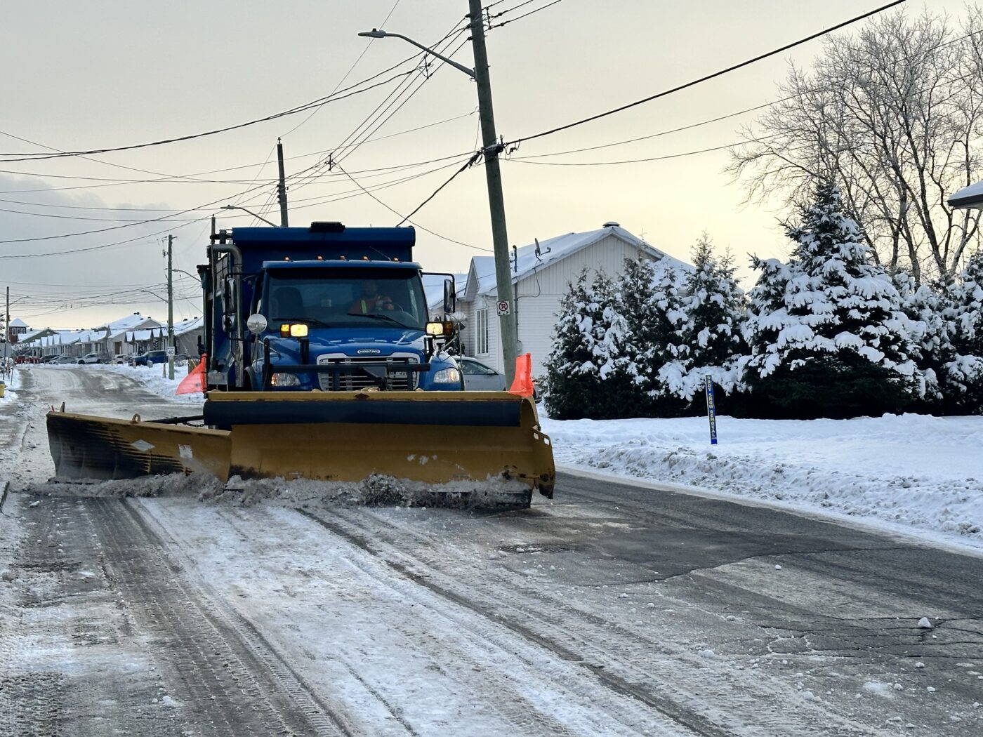 Photo of a snow removal truck passing on a street