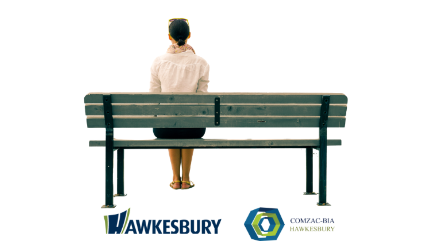 Photo of a person sitting on a bench with their back to the camera, with the logos of the City of Hawkesbury and COMZAC-BIA Hawkesbury below.